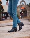 Woman in jeans wearing the Tecovas Stella boots.