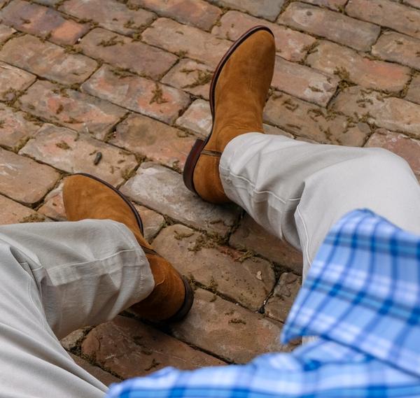 close up of Dean Honey Tan Suede cowboy boots on a man's feet 