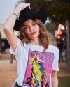 Woman with cowgirl hat on wearing a graphic tshirt