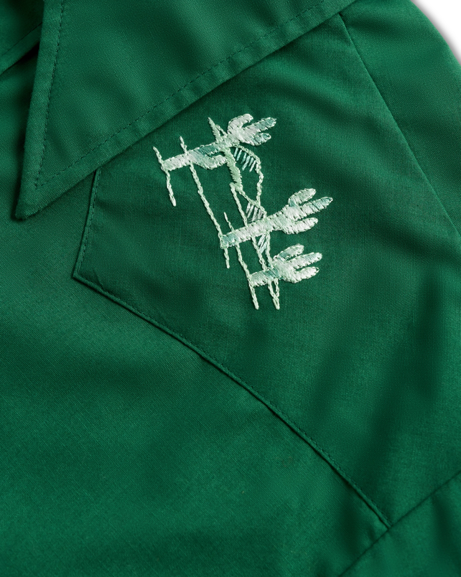 Closeup detail view of Tecovas x Cathy Hahn Men’s Vintage Embroidered Pearl Snap - Cactus Green