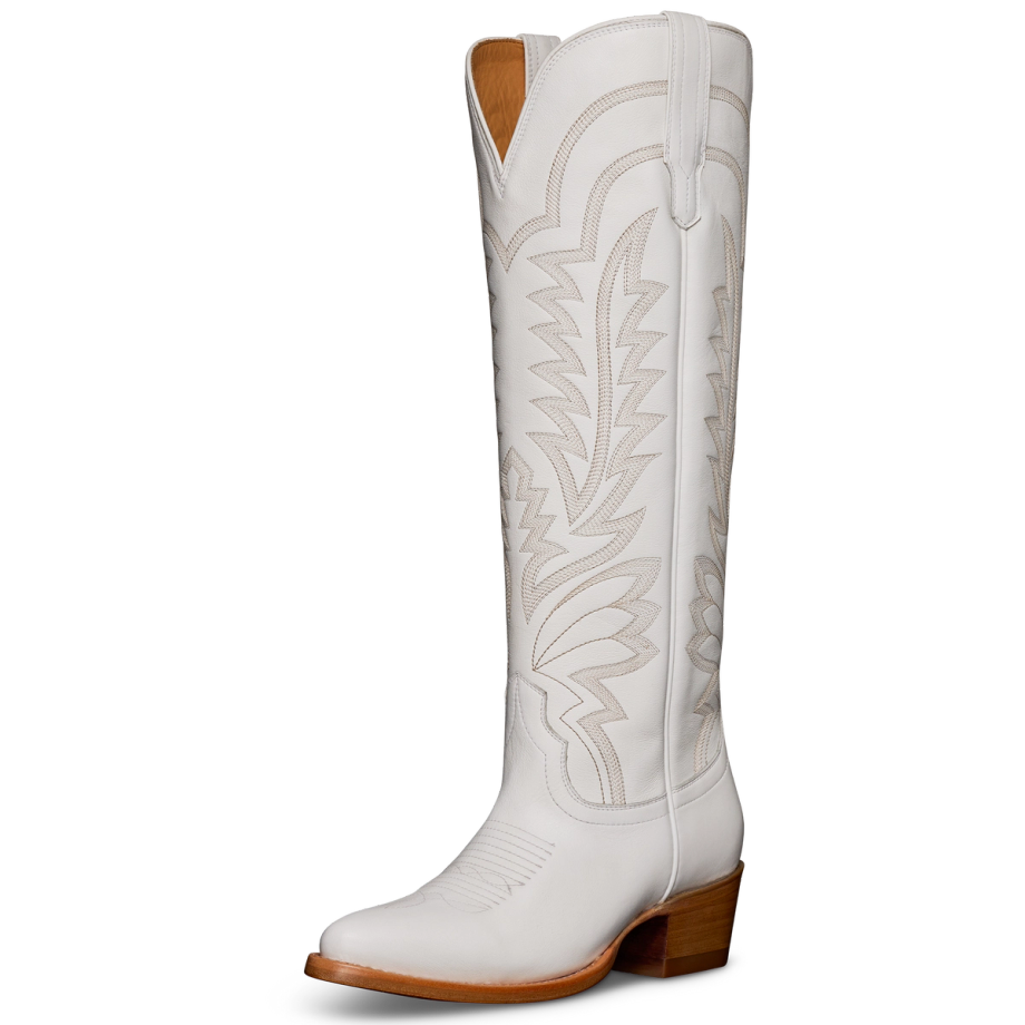 A tall, white cowboy boot with decorative stitching and a brown heel, viewed from the side.