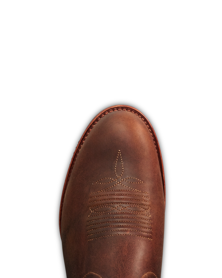 The Wayne in Maplewood Cowhide. Top view of a brown Maplewood Cowhide leather cowboy boot with decorative stitching on the toe, photographed against a white background.