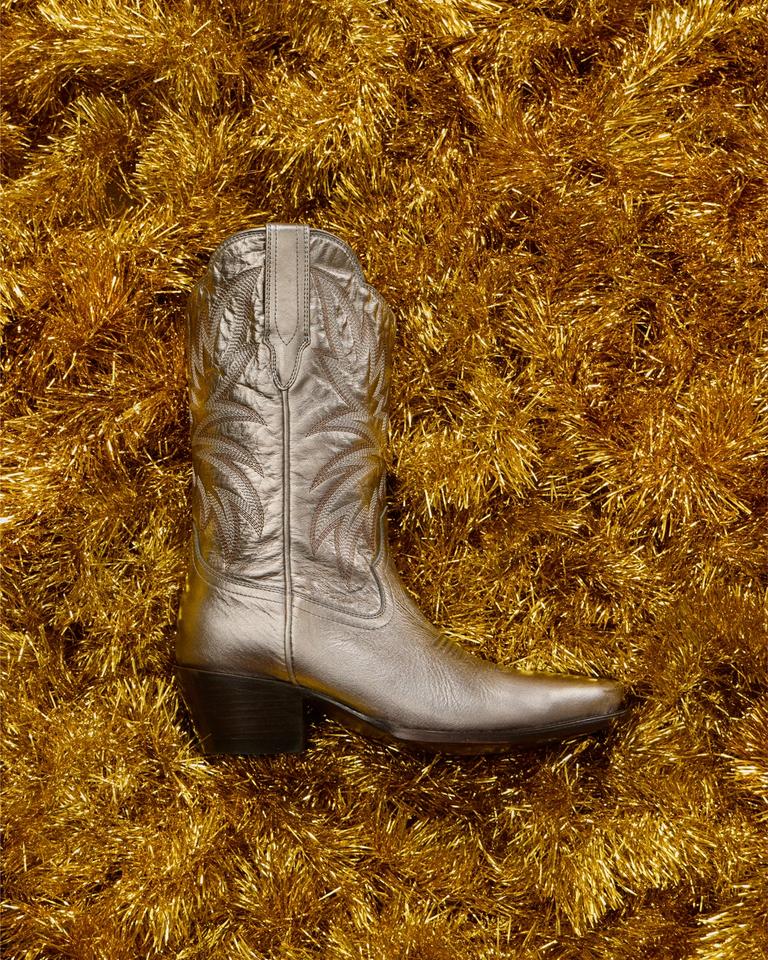 Metallic cowgirl boot on christmas decor.
