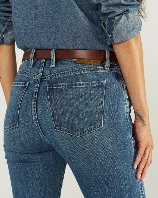 Closeup view of Women's Mid-Rise Slim Flare - Medium Wash