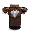 Brown garment bag opened to reveal a gray suit on a hanger, with extended side pockets and a small zippered compartment at the bottom.