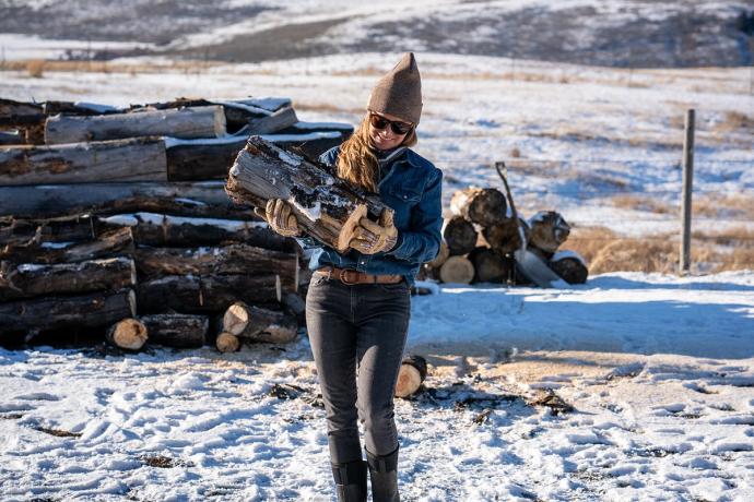 Malou holding firewood