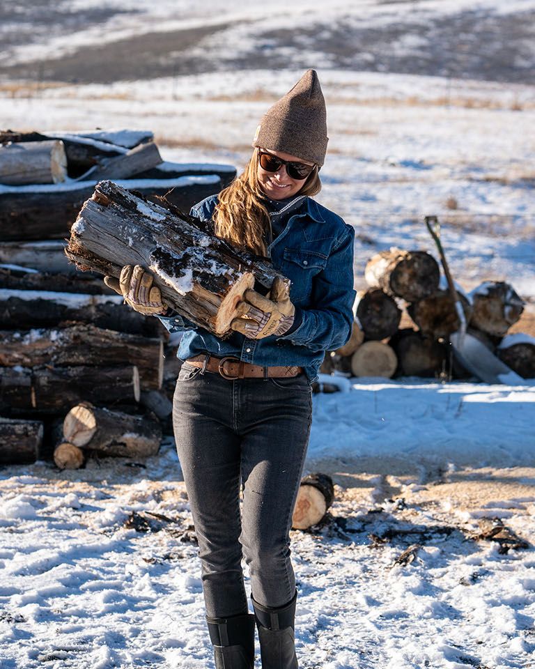 Malou holding firewood