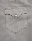 Closeup detail view of Men's Denim Pearl Snap - Light Gray