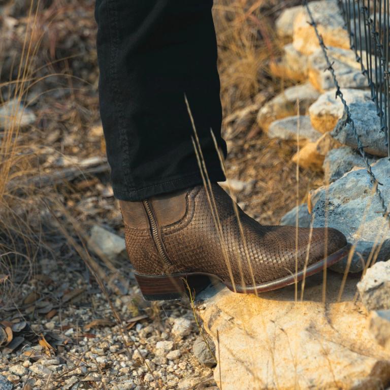 close up of mens python boots