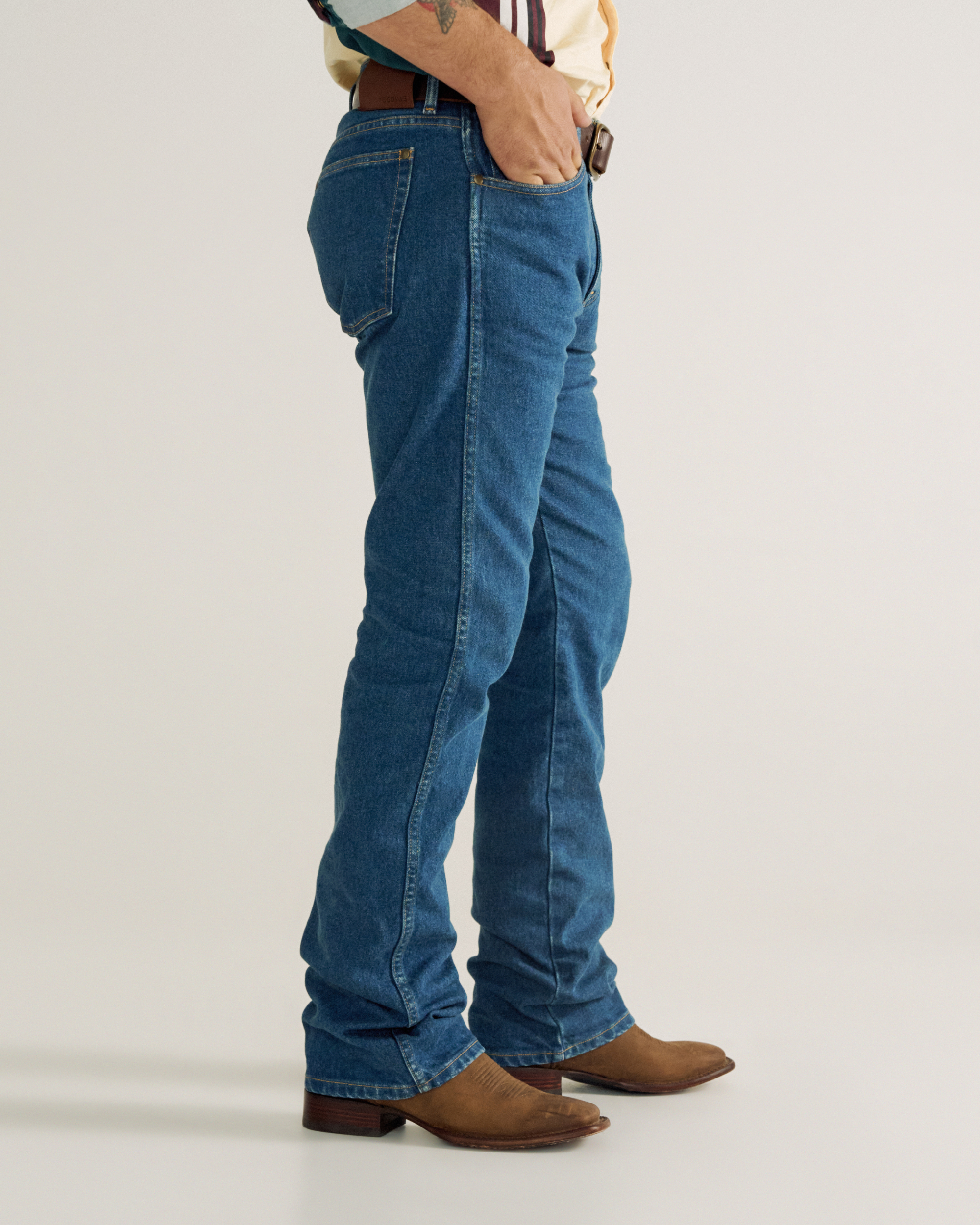 Front view of Men's Modern Bootcut Heritage Denim - Medium Blue on model