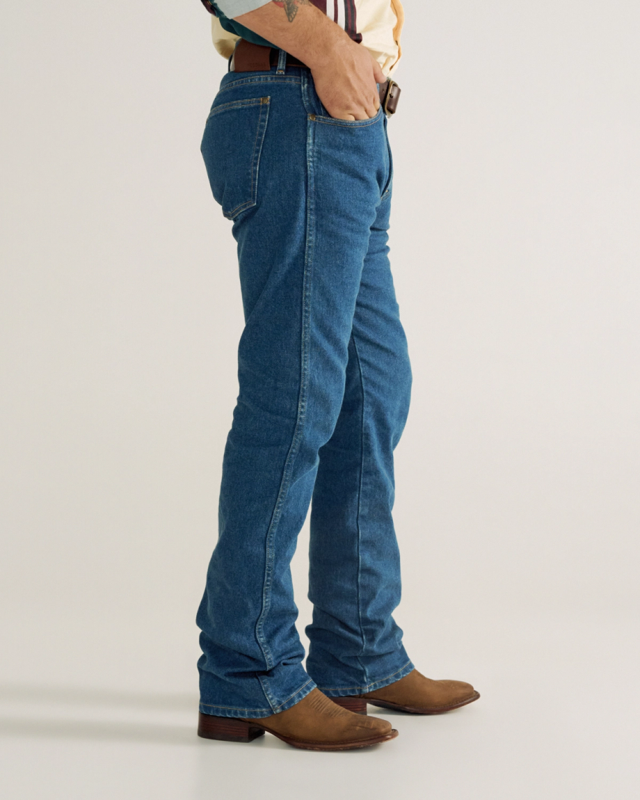 Front view of Men's Modern Bootcut Heritage Denim - Medium Blue on model