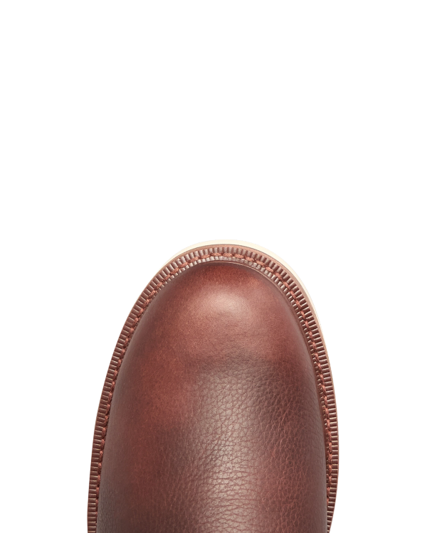 The Knox Lace Up in Cognac Cowhide. Close-up of the toe of a cognac cowhide boot with a welted sole.