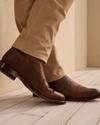 man wearing brown boots