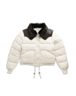 White puffer jacket with a black faux fur collar, black shoulder accents, front snap buttons, two front pockets, and drawstrings at the hem.