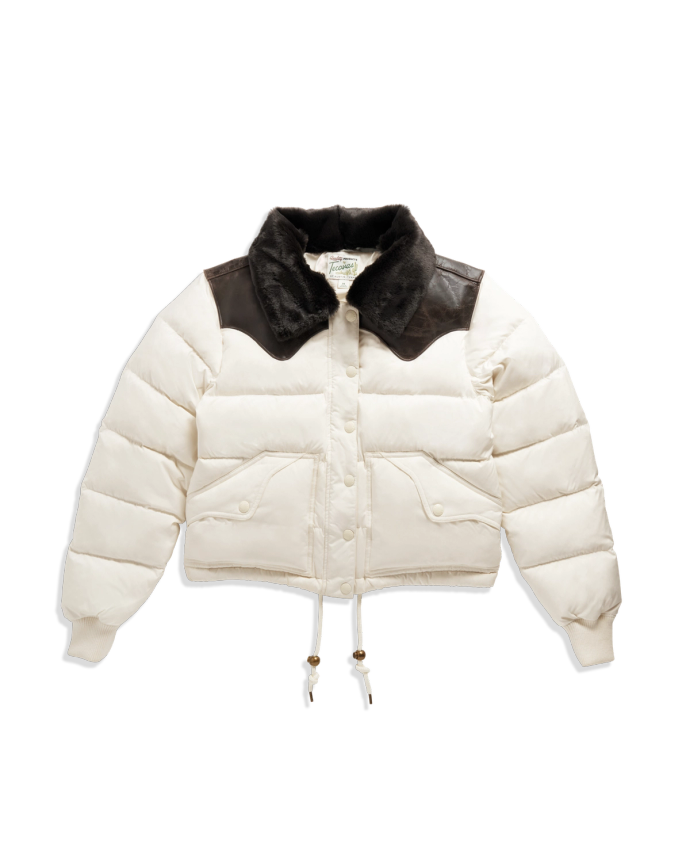 White puffer jacket with a black faux fur collar, black shoulder accents, front snap buttons, two front pockets, and drawstrings at the hem.