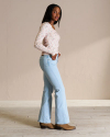 Back view of Women's Mid-Rise Bootcut Jeans - Light on model