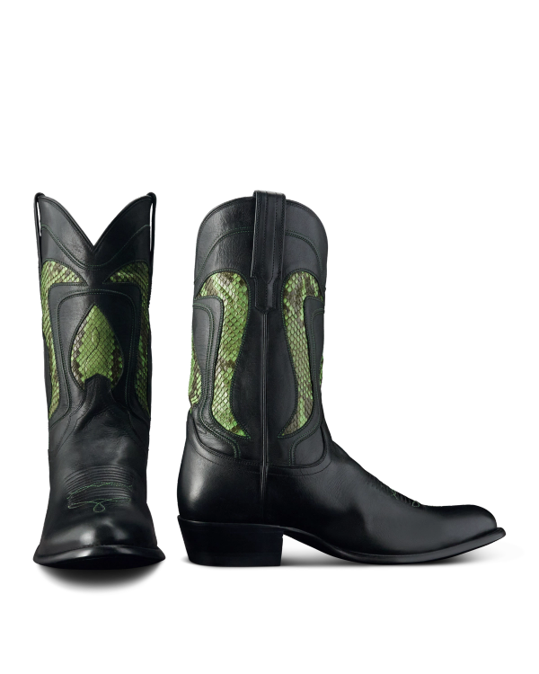 A pair of black cowboy boots with green snakeskin inlays on the shafts, shown from the front and side angles.