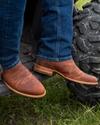close up picture of Earl scotch brown cowboy boots on a man's feet