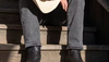 Man wearing The Dean ostrich zip boot in midnight color
