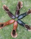 dillon cowboy boots in a circle in the grass