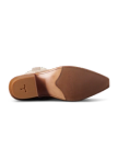 The image shows the sole of a brown leather shoe with a small heel and a textured grip pattern.