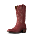 The Britt in Redwood Goat. A single red leather cowboy boot from Redwood Goat, featuring decorative stitching, a pointed toe, and a stacked heel, shown at a slight angle on a plain white background.