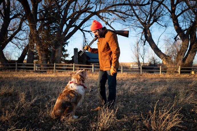 man with a dog in a field