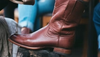 Image of brown boot on a shoe shine stand