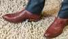 Man in suit wearing bourbon colored lizard boots