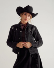 Front view of Women's Rodeo Concho Denim Jacket - Black on model