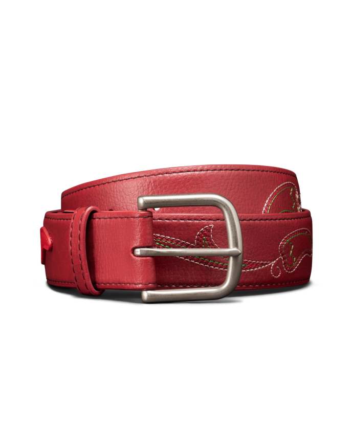 A red leather belt with a silver buckle and decorative stitching, rolled up against a black background.