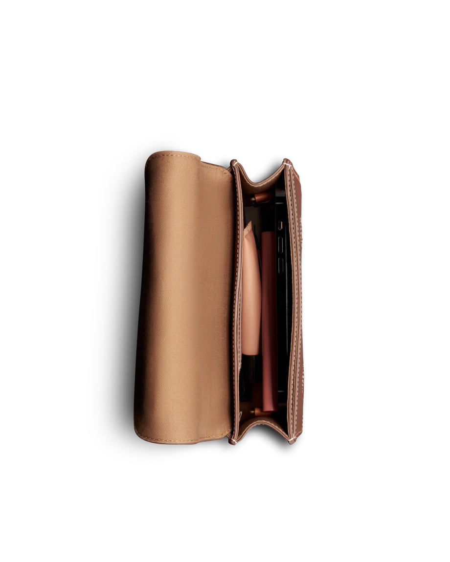 Inside view of Concho Chain Crossbody - Saddle on plain background