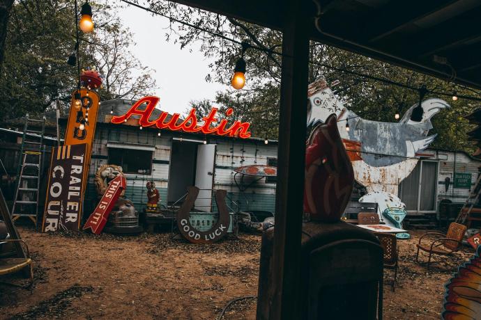 neon sign spelling Austin on a shed