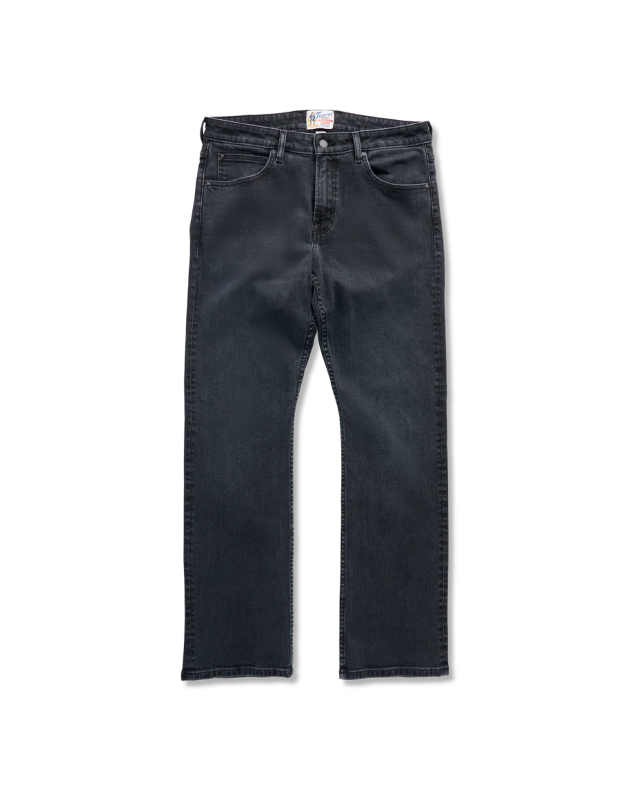 A pair of black denim jeans laid flat against a black background, featuring a classic five-pocket design and straight leg cut.