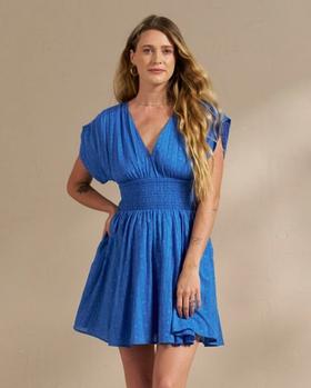 Closeup of woman wearing blue dress in photo studio