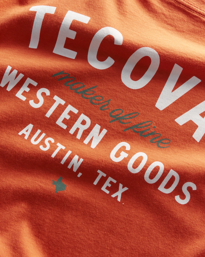 Flatlay image of the orange rust tecovas t shirt on a plain background