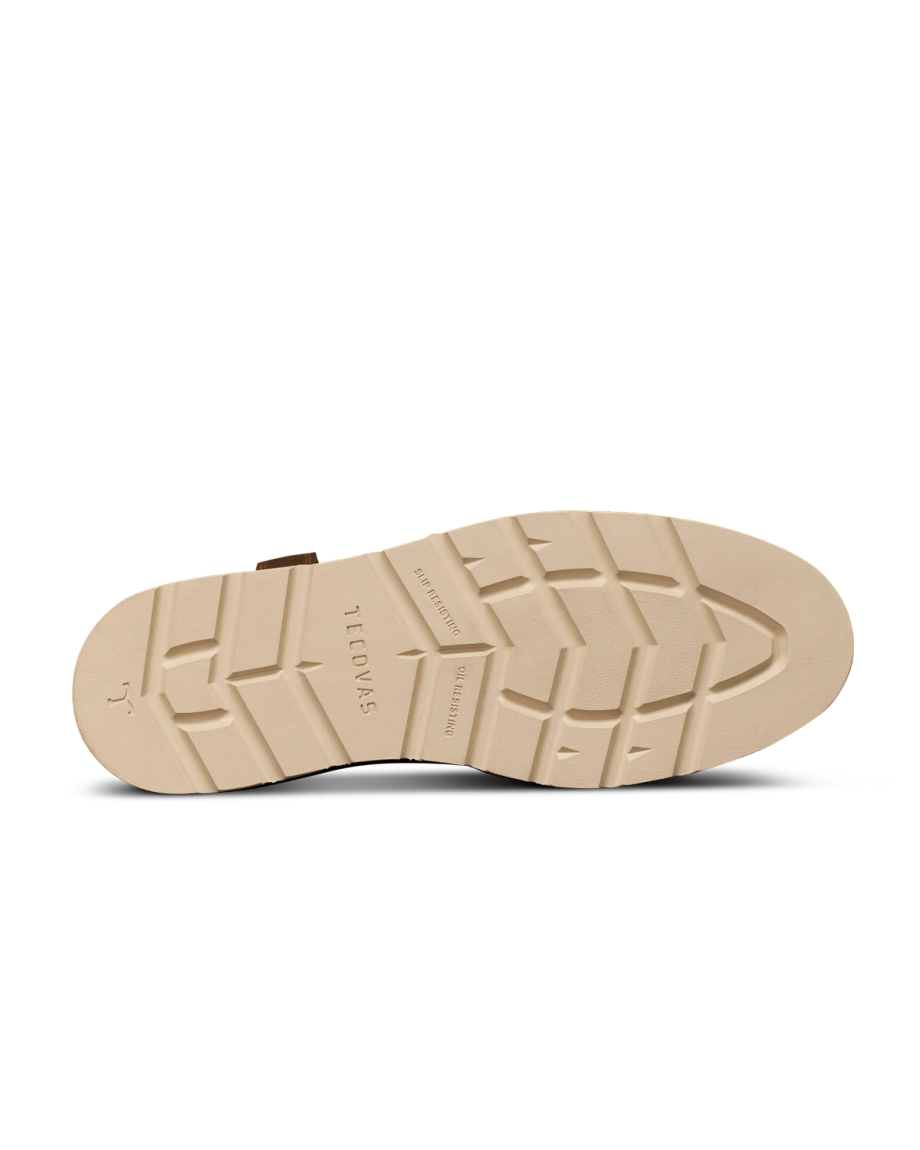 The Knox in Wheat Cowhide. The image shows the beige rubber sole of The Knox Cowhide shoe with the brand "Tecovas" and size marking engraved, featuring a patterned tread for grip.