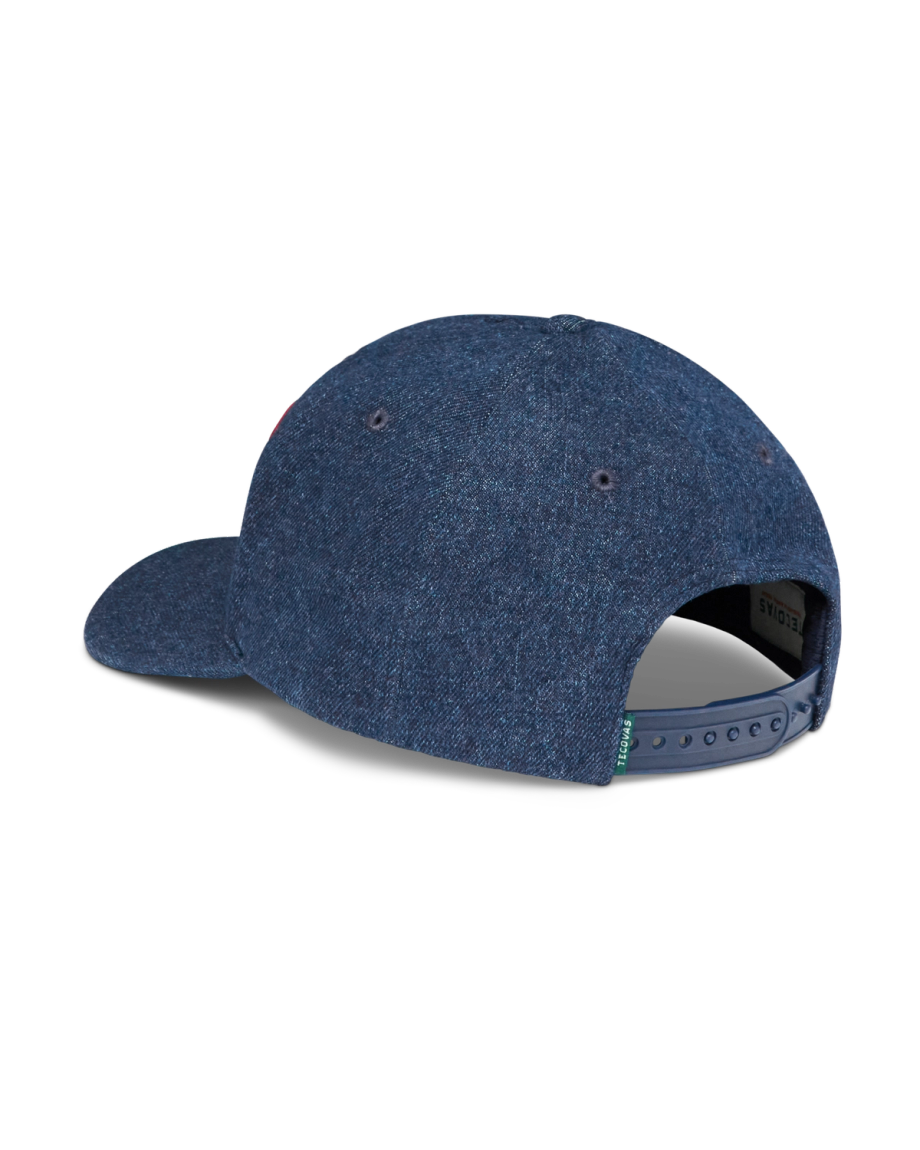 A blue denim baseball cap shown from the back, featuring an adjustable snapback closure and ventilation eyelets.