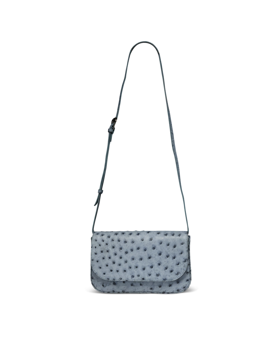 A blue ostrich leather shoulder bag with an adjustable strap and textured, dimpled surface, displayed against a plain white background.