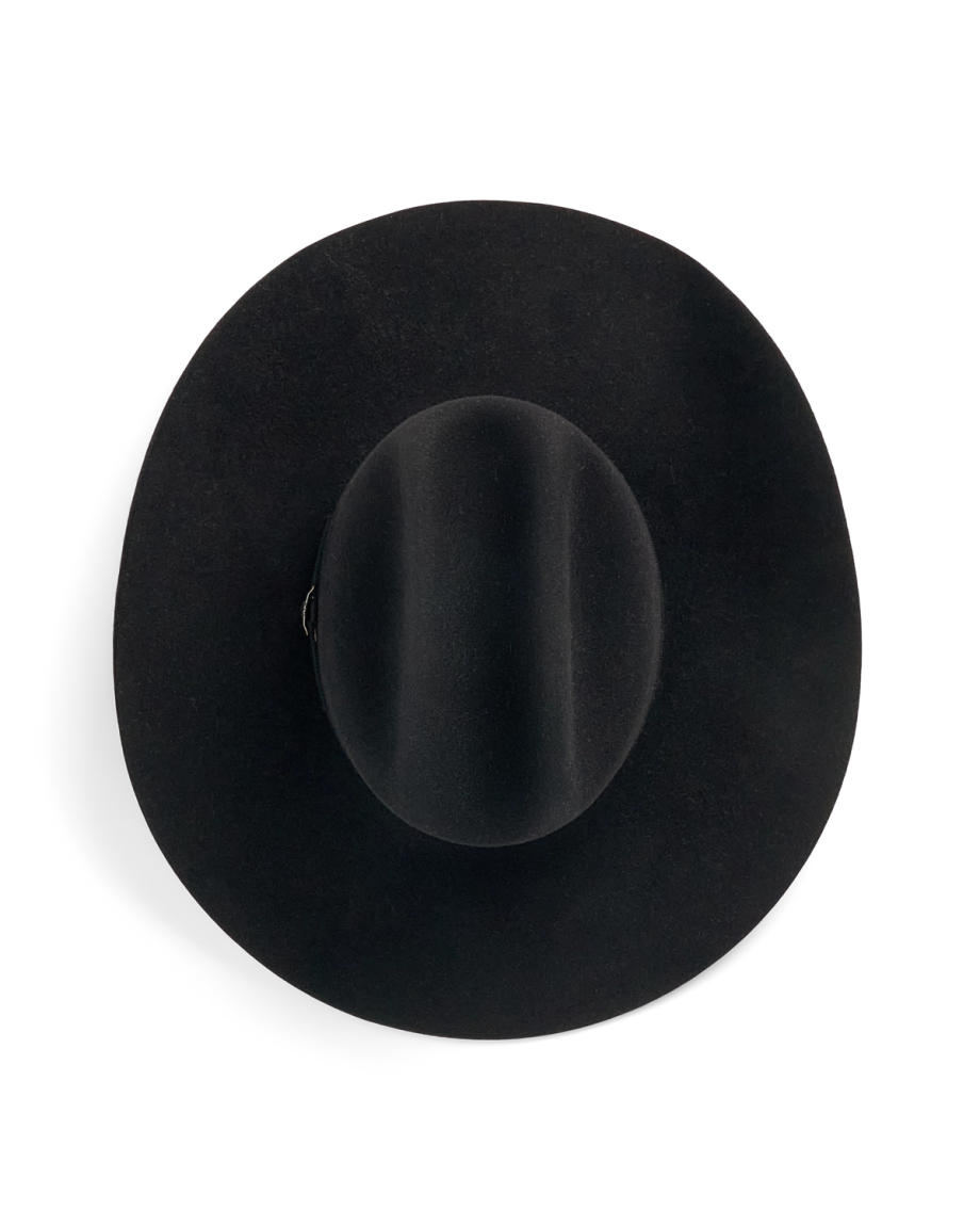 A wide-brimmed black felt hat is shown photographed from above on a plain white background.