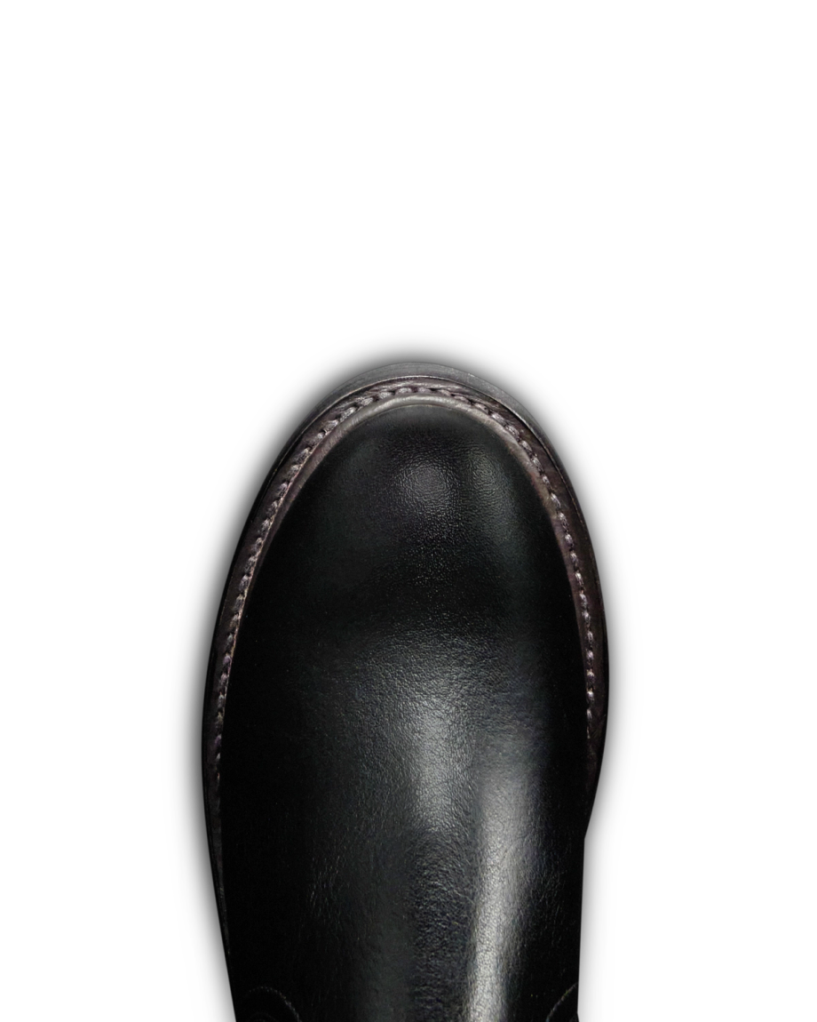 Toe view of The Rugged Chelsea - Midnight Cowhide on plain background