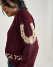 Front view of Women's Crew Neck Lucky Boots Sweater - Burgundy on model