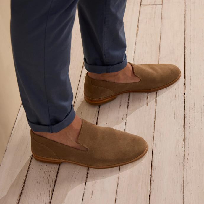 man wearing a granite grey suede slip on shoe