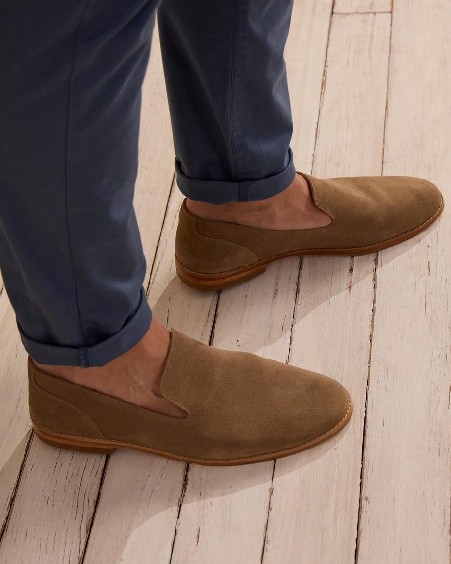 man wearing a granite grey suede slip on shoe
