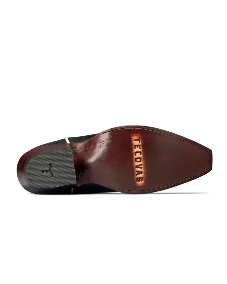 The Annie in Midnight Roses Cowhide. Bottom view of The Annie Cowhide Tecovas western boot sole, showing a dark brown leather outsole with a rubber heel pad and the brand name stamped near the toe.