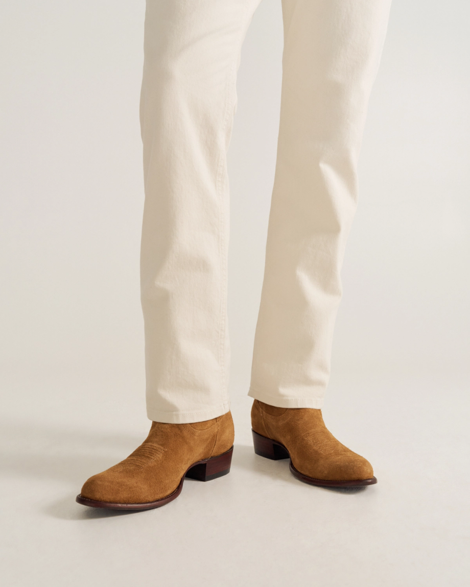 close up of Johnny Honey Tan cowboy boots on a man's feet