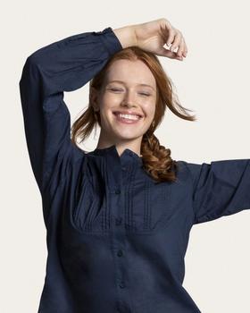 woman wearing indigo blue button down shirt 