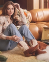 woman in two tone brown caramel and white mid-calf cowgirl boots