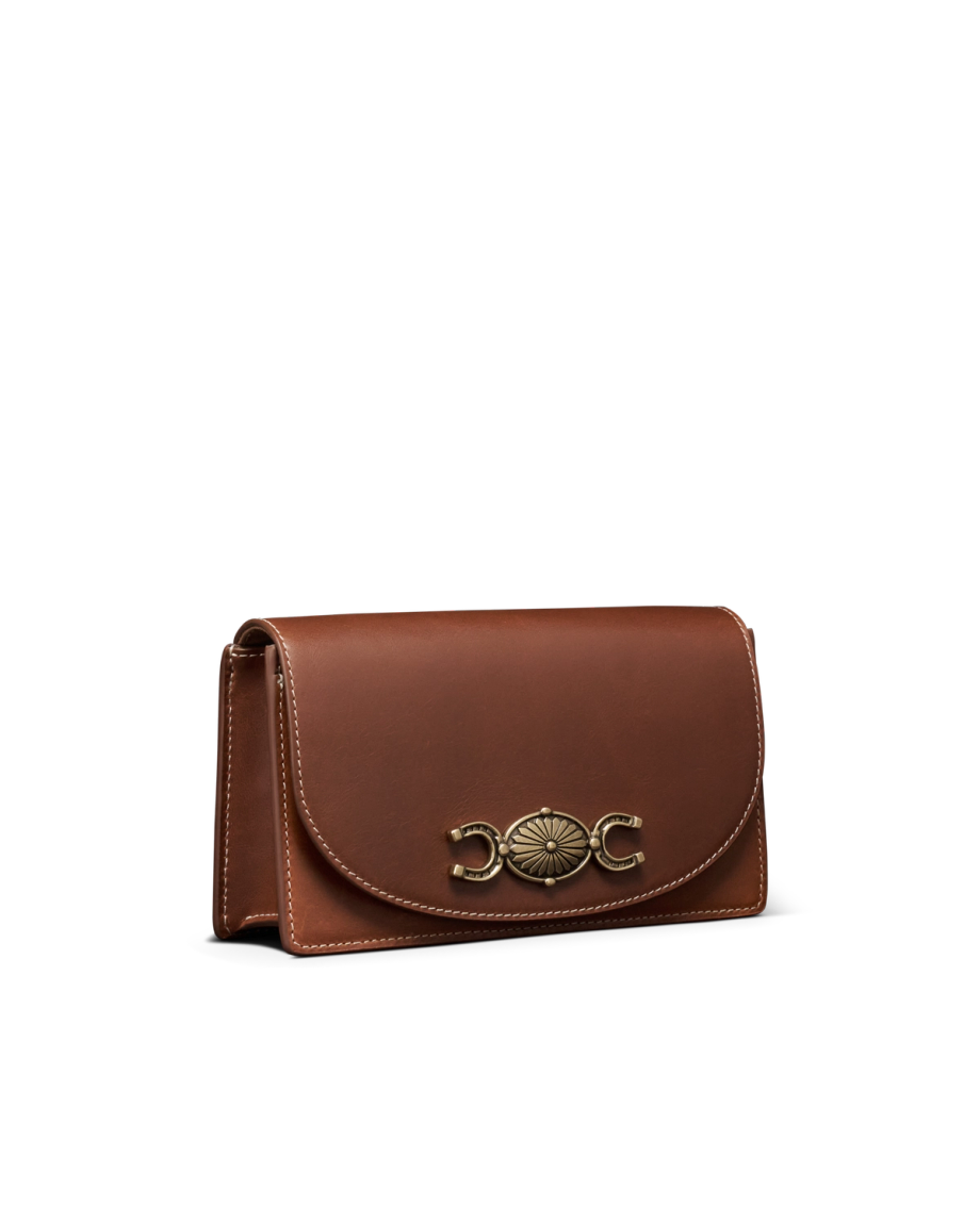 Quarterfront view of Concho Chain Crossbody - Saddle on plain background
