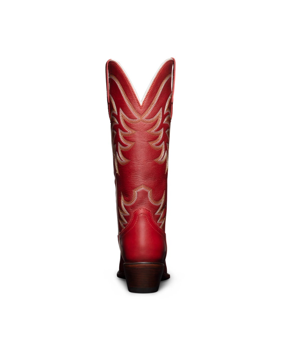 Red cowboy boot with tan decorative stitching, shown from the back against a black background.
